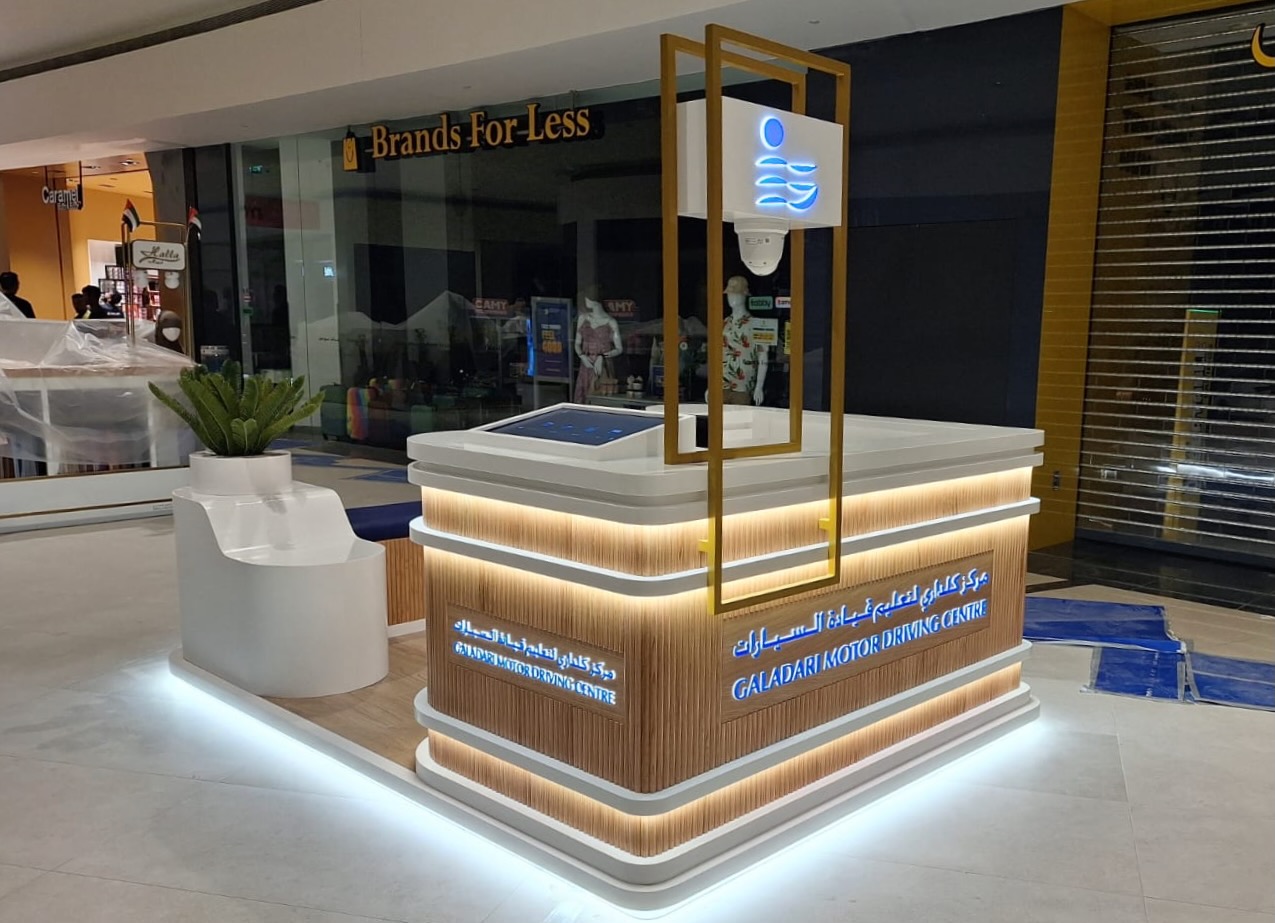 Branded mall kiosk fitout with counters and display surfaces