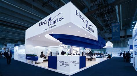 Two-story double-decker custom exhibition stand with VIP mezzanine lounge and glass railings at DWTC