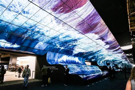 Immersive 360-degree LED walkthrough tunnel at an exhibition with interactive digital visuals and visitor flow