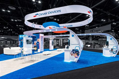 Suspended architectural halo ring banner floating above exhibition stand at Dubai World Trade Centre